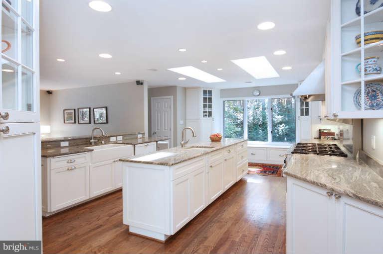 525 Clear Spring Road Great Falls, VA 22066 - Photo 2 of 30 a large kitchen with stainless steel appliances lots of counter space and a sink
