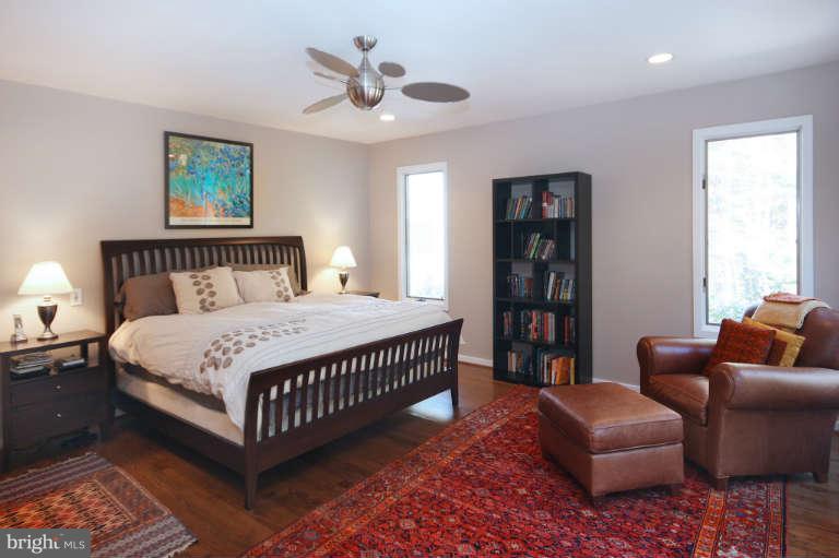 525 Clear Spring Road Great Falls, VA 22066 - Photo 12 of 30 a bedroom with a bed furniture and a window