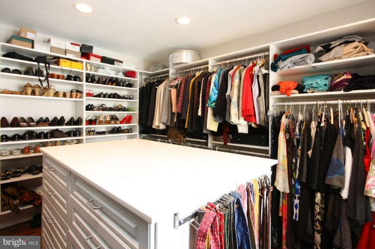 525 Clear Spring Road Great Falls, VA 22066 - Photo 13 of 30 a view of walk in closet with clothes and shoes