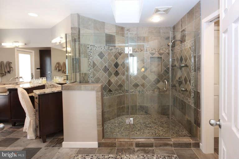 525 Clear Spring Road Great Falls, VA 22066 - Photo 14 of 30 a bathroom with a shower