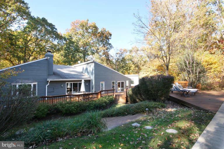 525 Clear Spring Road Great Falls, VA 22066 - Photo 3 of 30 a view of a house with a yard and large tree