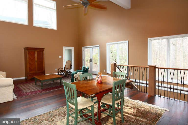 525 Clear Spring Road Great Falls, VA 22066 - Photo 25 of 30 a view of a dining room with furniture and wooden floor