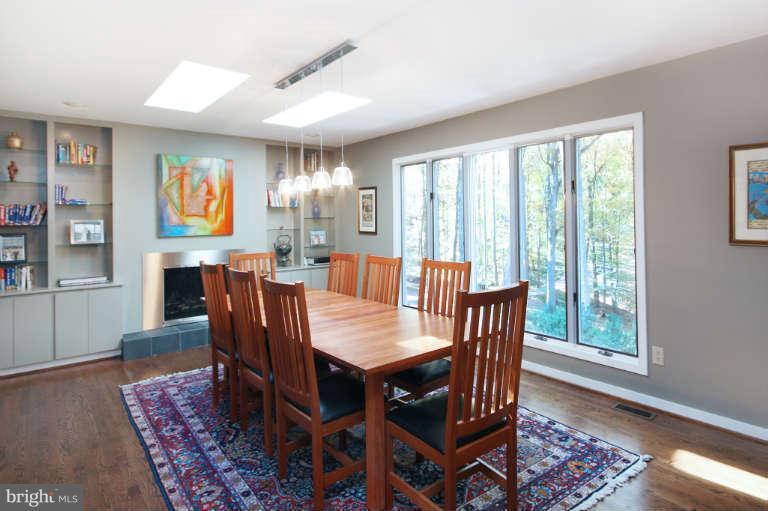 525 Clear Spring Road Great Falls, VA 22066 - Photo 7 of 30 a view of a dining room with furniture window and wooden floor
