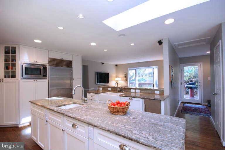 525 Clear Spring Road Great Falls, VA 22066 - Photo 8 of 30 a kitchen with sink and refrigerator