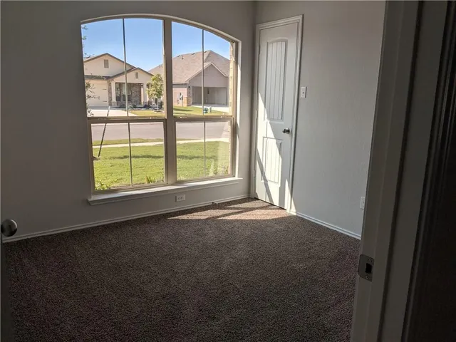 a view of empty room with a window