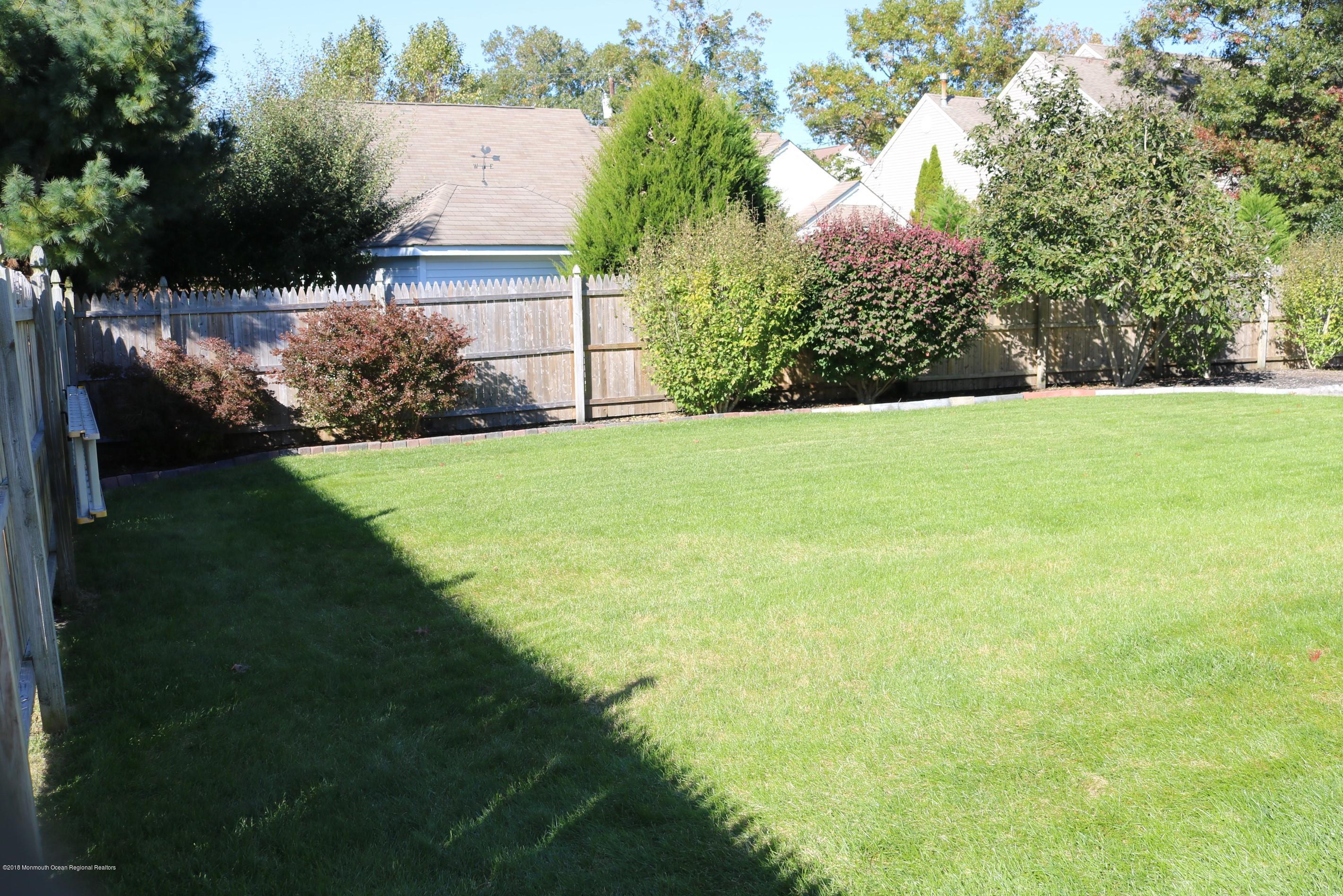 112 Torpedo Road Manahawkin, NJ 08050 - Photo 3 of 49 a view of an outdoor space and a yard