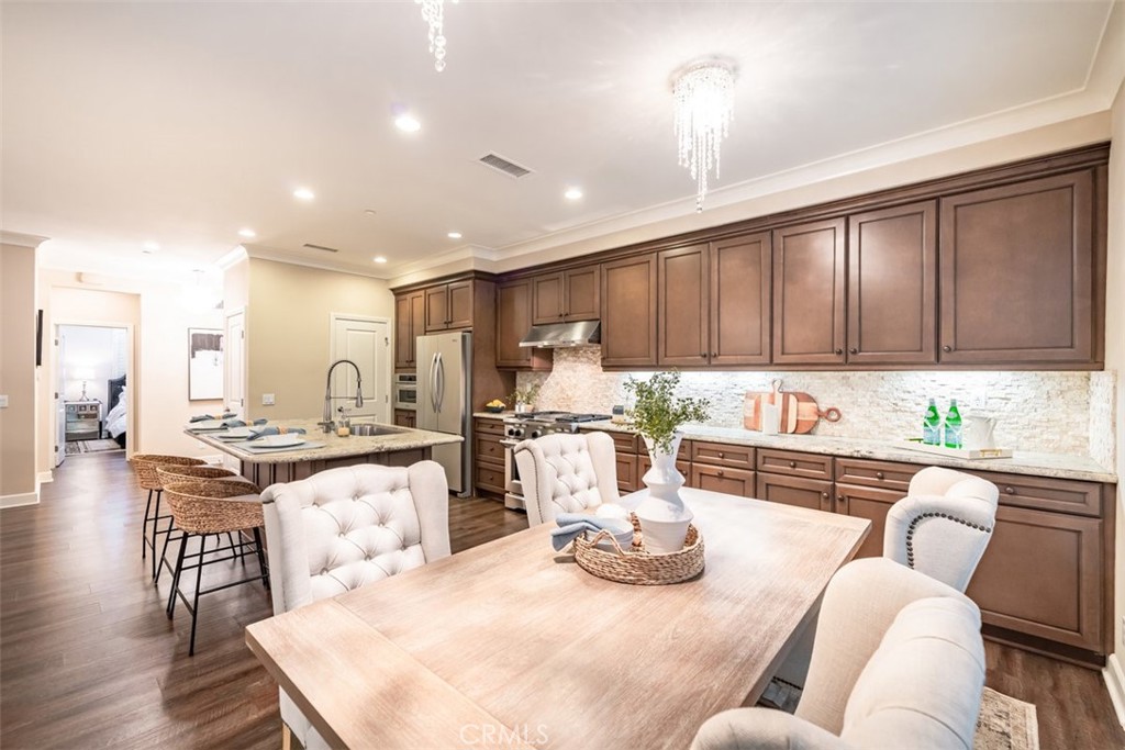 43 Lupari Irvine, CA 92618 - Photo 17 of 68 a living room with furniture kitchen and a wooden floor