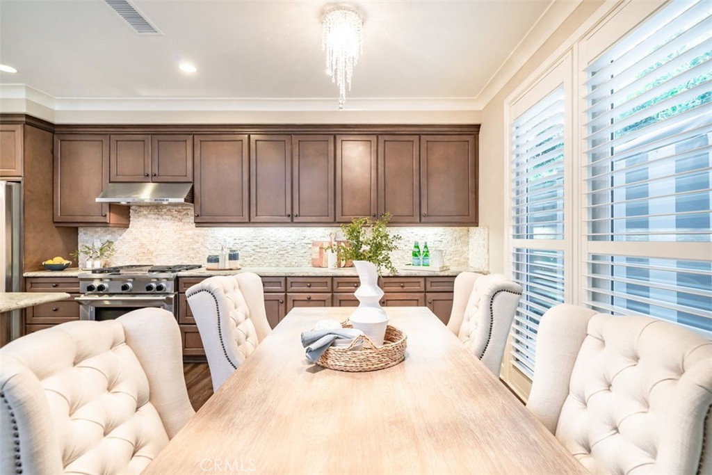 43 Lupari Irvine, CA 92618 - Photo 18 of 68 a kitchen with stainless steel appliances granite countertop a stove a sink and a refrigerator