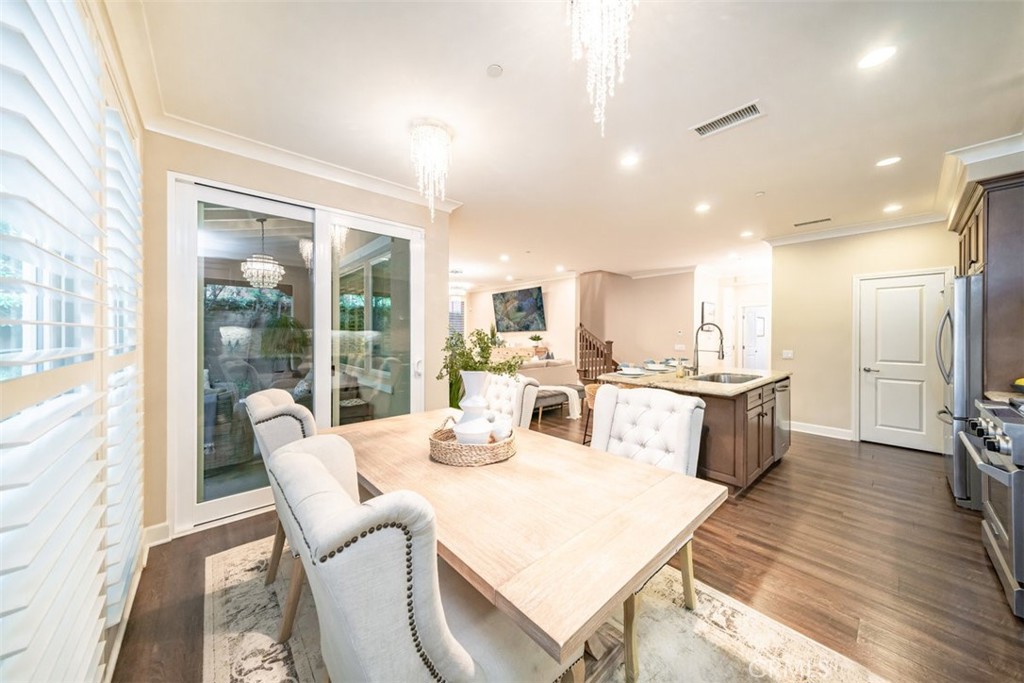 43 Lupari Irvine, CA 92618 - Photo 20 of 68 a dining room with furniture and wooden floor