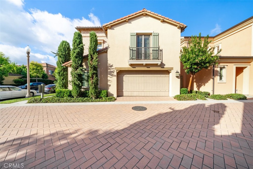43 Lupari Irvine, CA 92618 - Photo 2 of 68 a front view of a house with a yard and garage