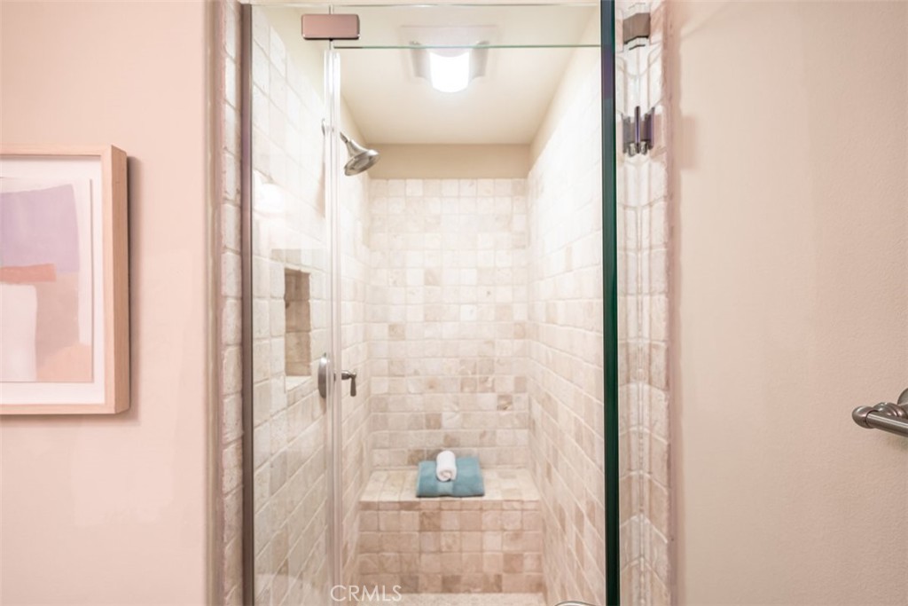 43 Lupari Irvine, CA 92618 - Photo 27 of 68 a bathroom with a glass shower door