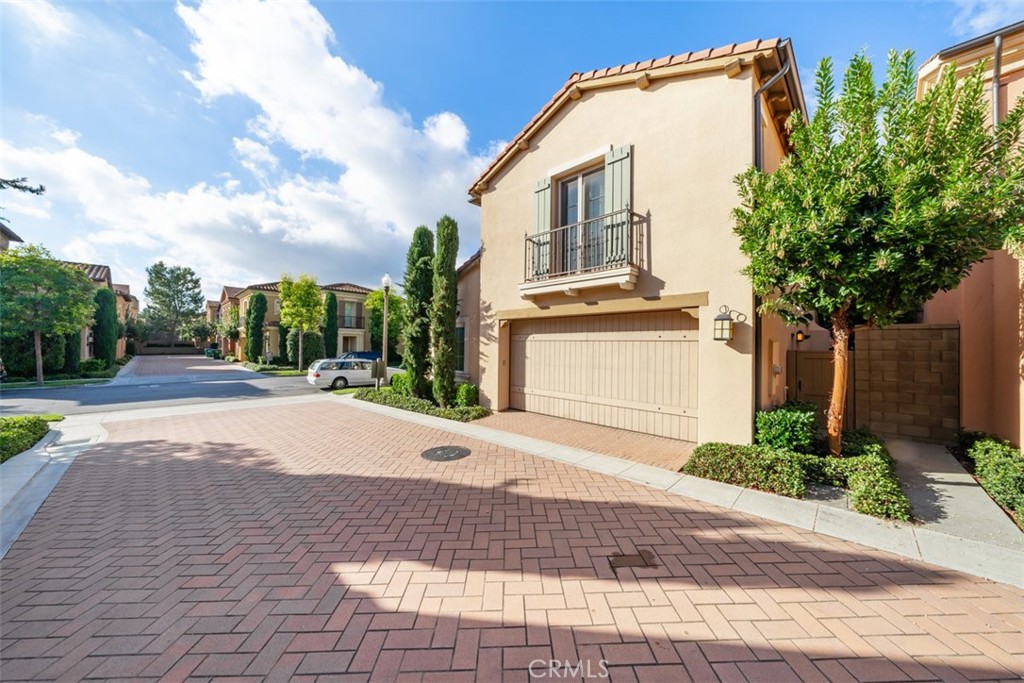 43 Lupari Irvine, CA 92618 - Photo 3 of 68 a front view of a house with a yard and trees
