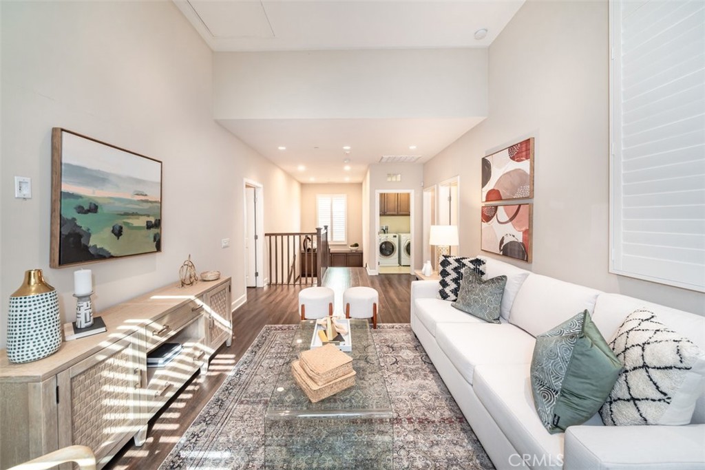 43 Lupari Irvine, CA 92618 - Photo 35 of 68 a living room with furniture and a wooden floor