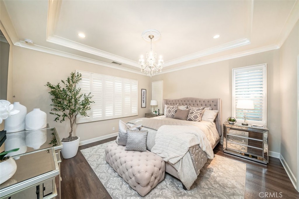 43 Lupari Irvine, CA 92618 - Photo 37 of 68 a spacious bedroom with a bed and a couch