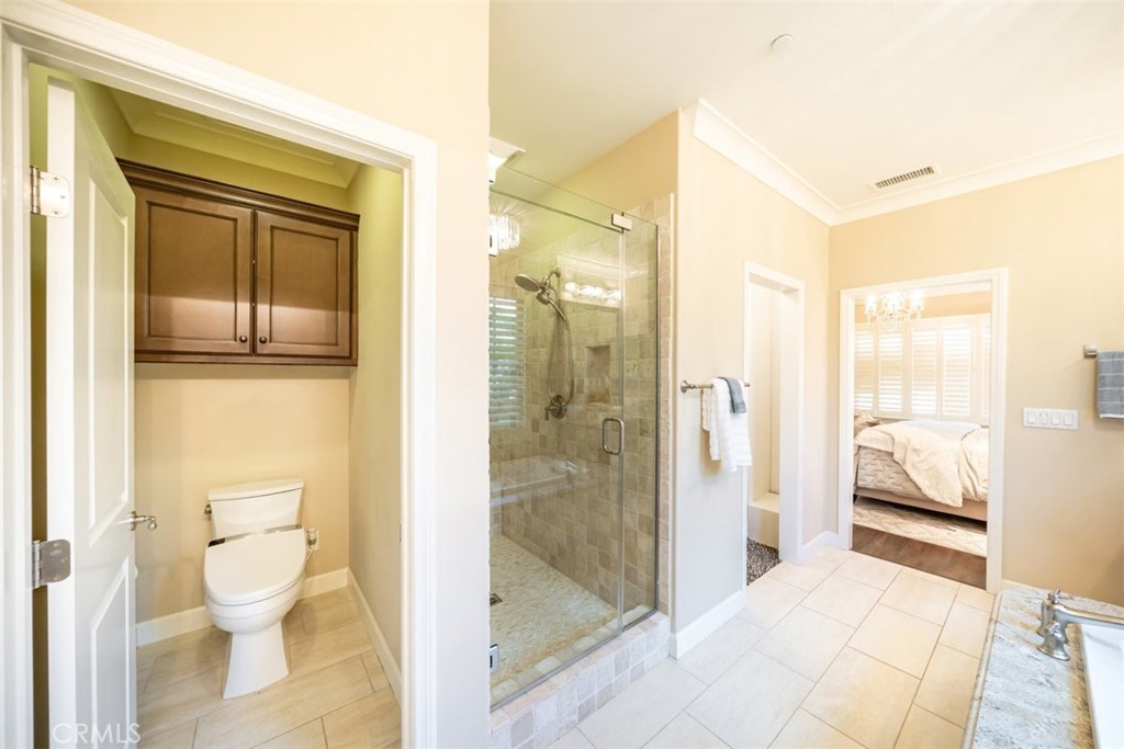 43 Lupari Irvine, CA 92618 - Photo 45 of 68 a bathroom with a sink and a glass door shower