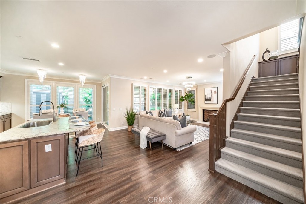 43 Lupari Irvine, CA 92618 - Photo 5 of 68 a living room with furniture and a wooden floor