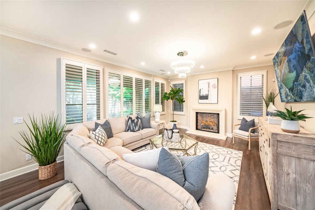 43 Lupari Irvine, CA 92618 - Photo 6 of 68 a living room with furniture a large window and a fireplace