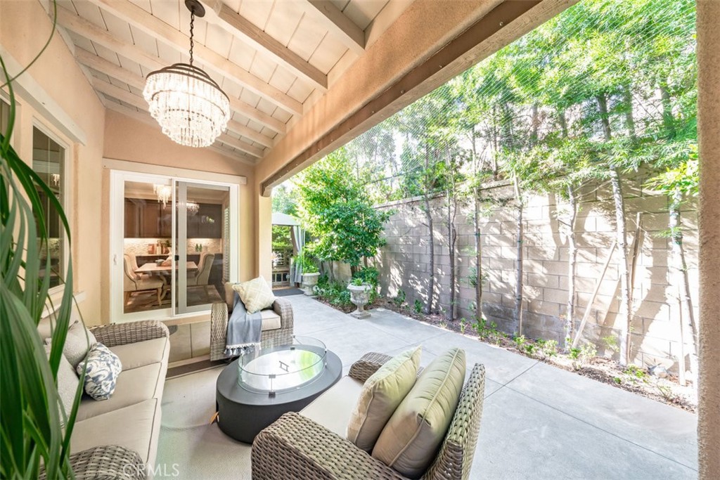 43 Lupari Irvine, CA 92618 - Photo 63 of 68 a view of a dining room with furniture large windows and wooden floor