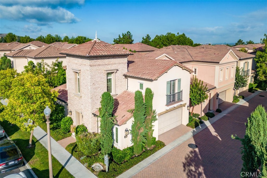 43 Lupari Irvine, CA 92618 - Photo 66 of 68 a front view of a house with a yard