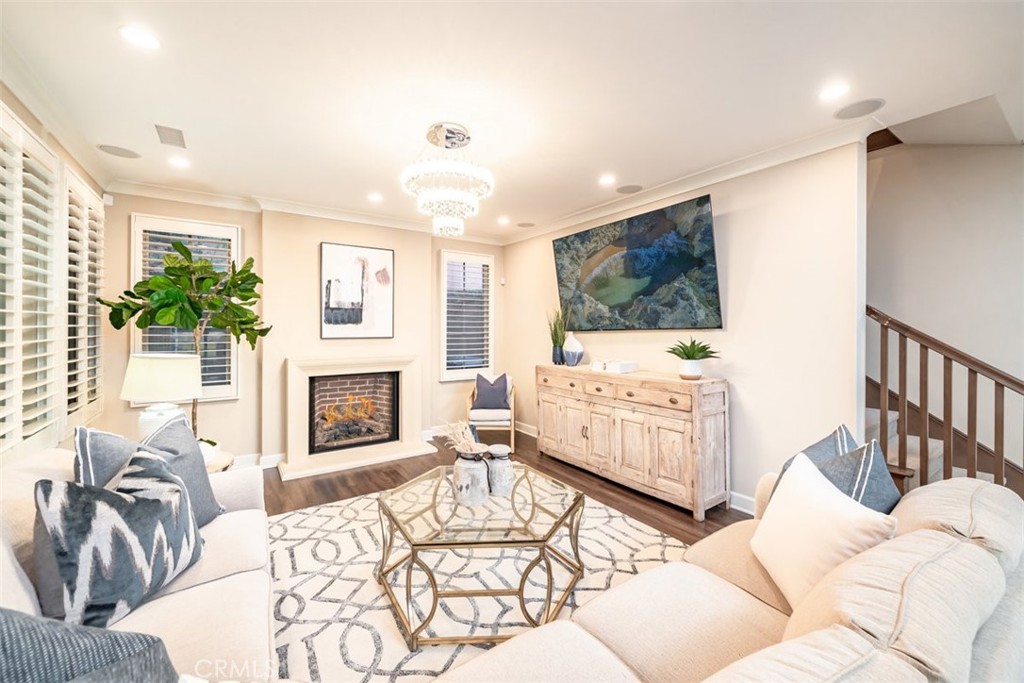 43 Lupari Irvine, CA 92618 - Photo 8 of 68 a living room with furniture and a fireplace