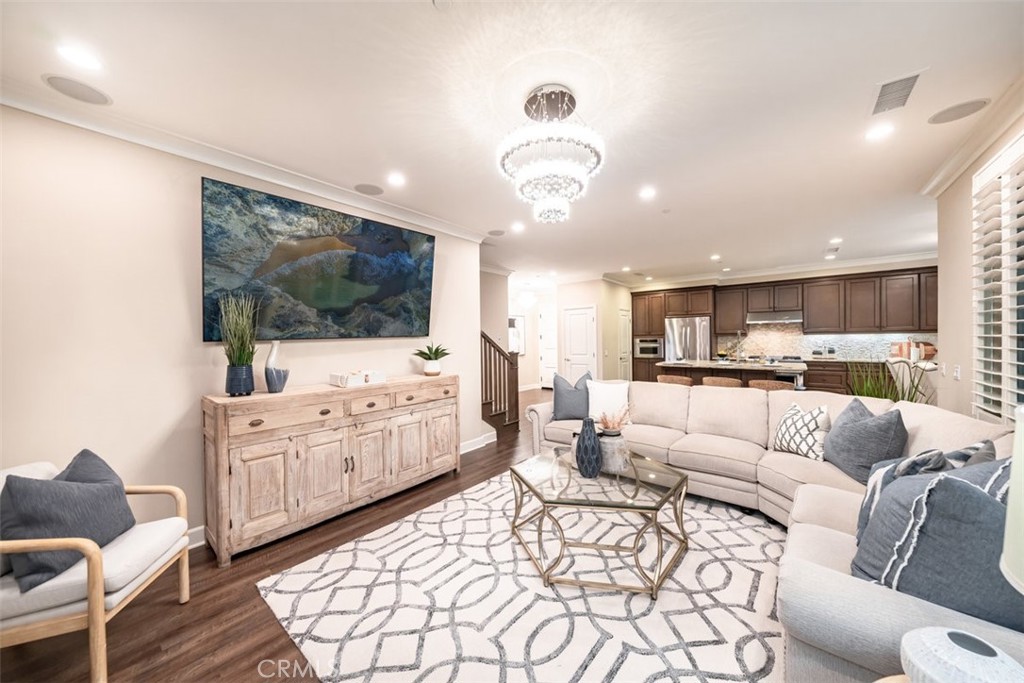 43 Lupari Irvine, CA 92618 - Photo 9 of 68 a living room with furniture and a flat screen tv