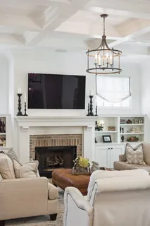 a bedroom with a bed and flat screen tv