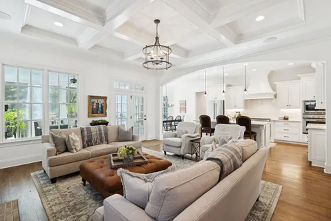 a living room with furniture and a ceiling fan