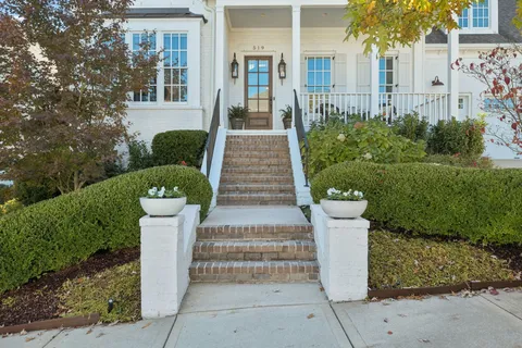 a view of entryway with wooden floor and stairs
