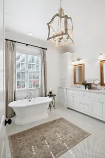 an aerial view of residential houses with outdoor space and parking