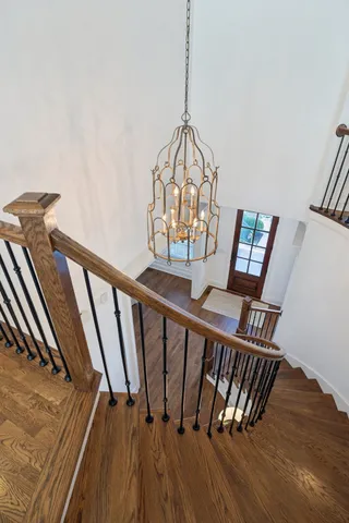 an aerial view of residential houses with outdoor space and parking