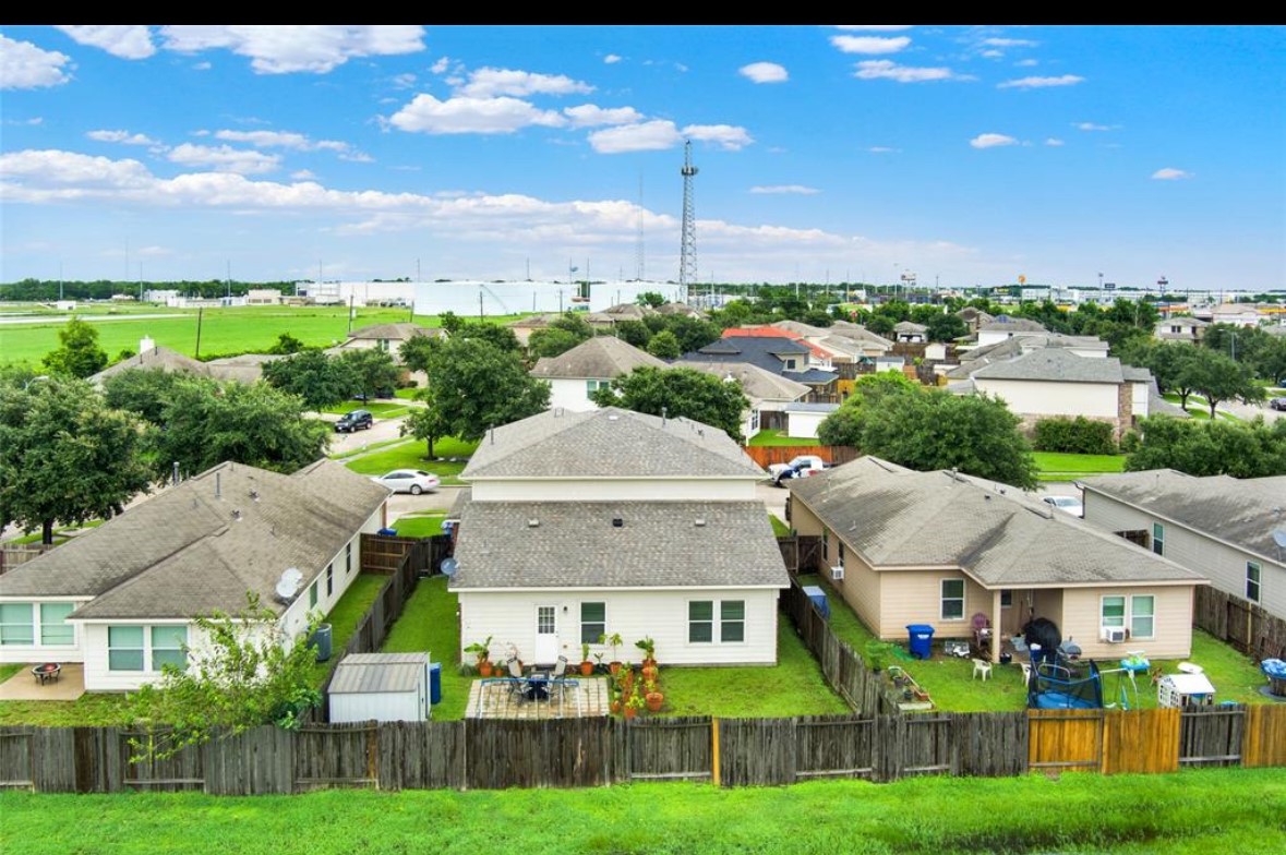 7035 Primrose Road Baytown, TX 77521 - Photo 18 of 18 a aerial view of a house with a big yard