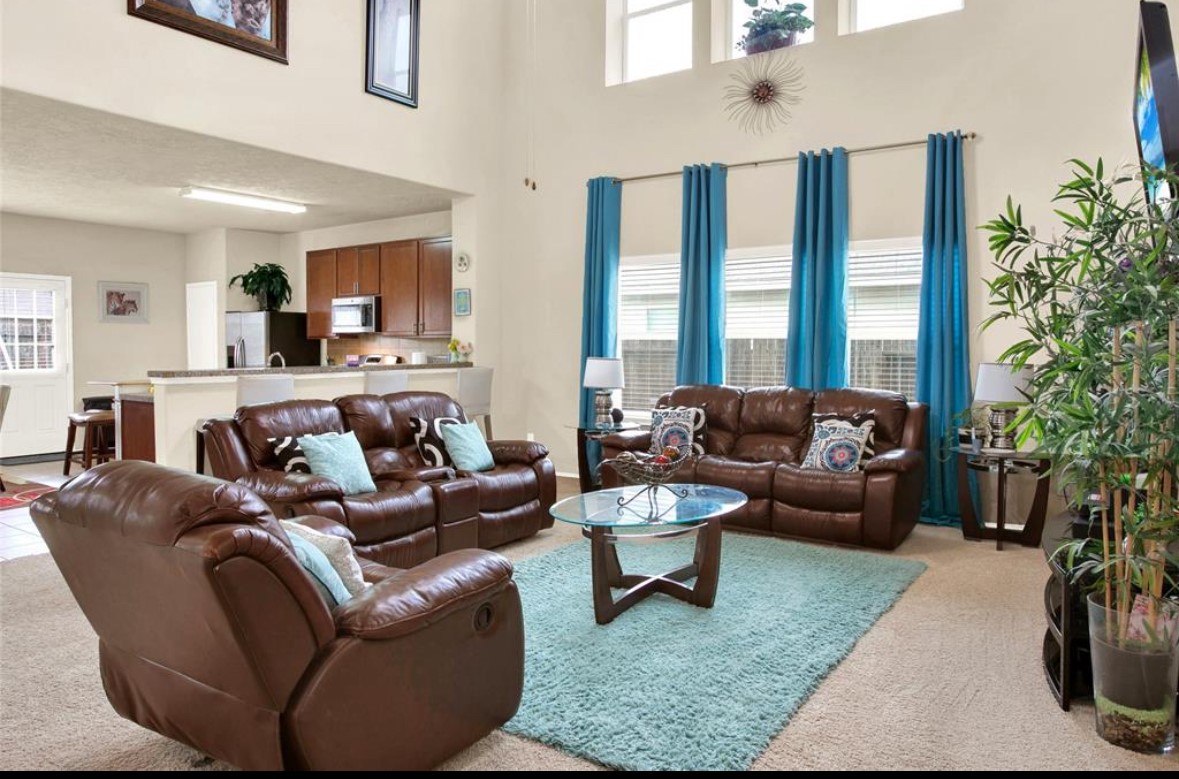 7035 Primrose Road Baytown, TX 77521 - Photo 2 of 18 a living room with furniture and a large window