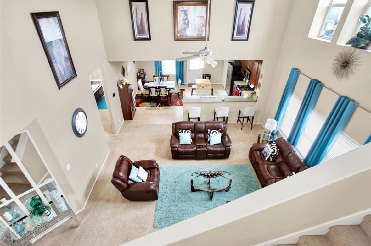 7035 Primrose Road Baytown, TX 77521 - Photo 6 of 18 a living room with furniture and a mirror