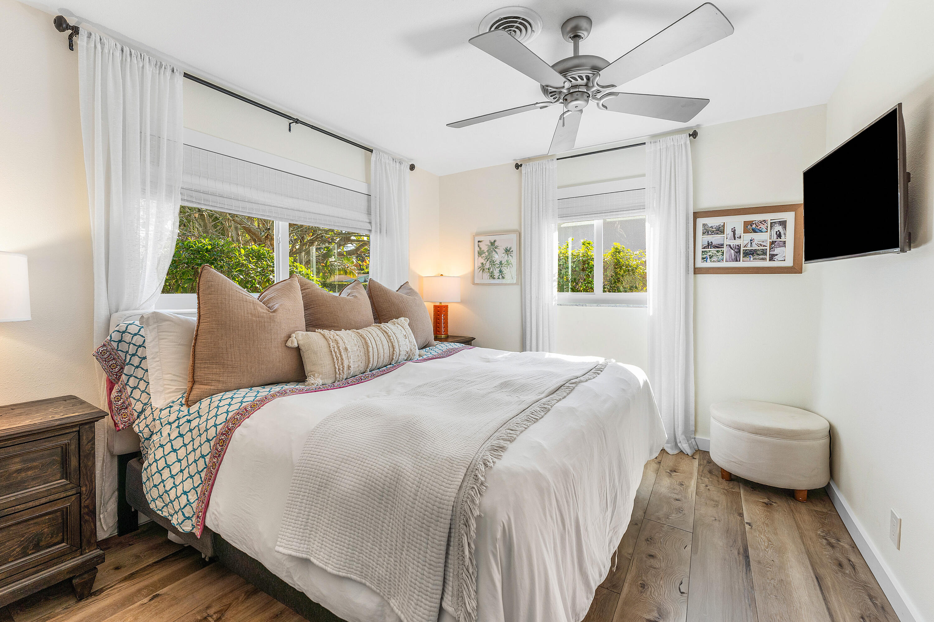 514 Dover Road Tequesta, FL 33469 - Photo 19 of 37 a bedroom with a bed and a flat screen tv