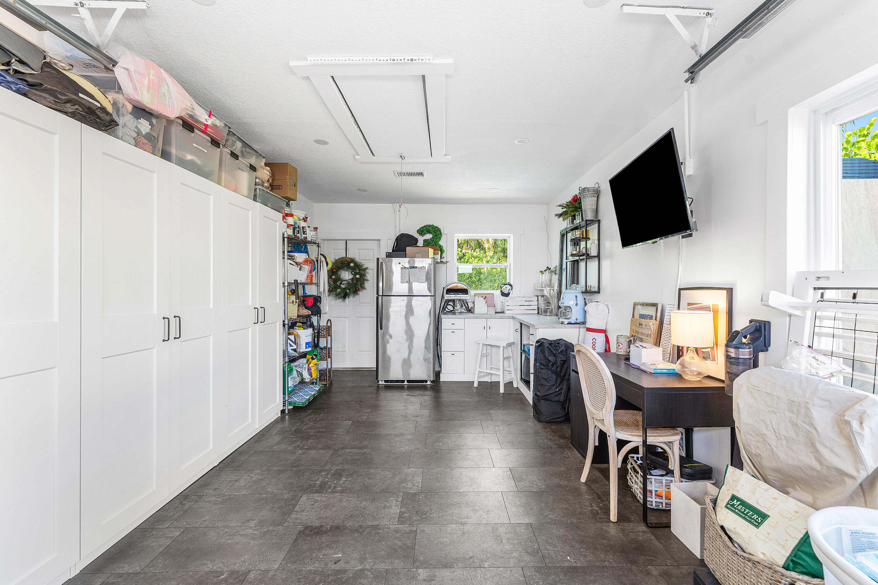 514 Dover Road Tequesta, FL 33469 - Photo 27 of 37 a living room with furniture and a flat screen tv