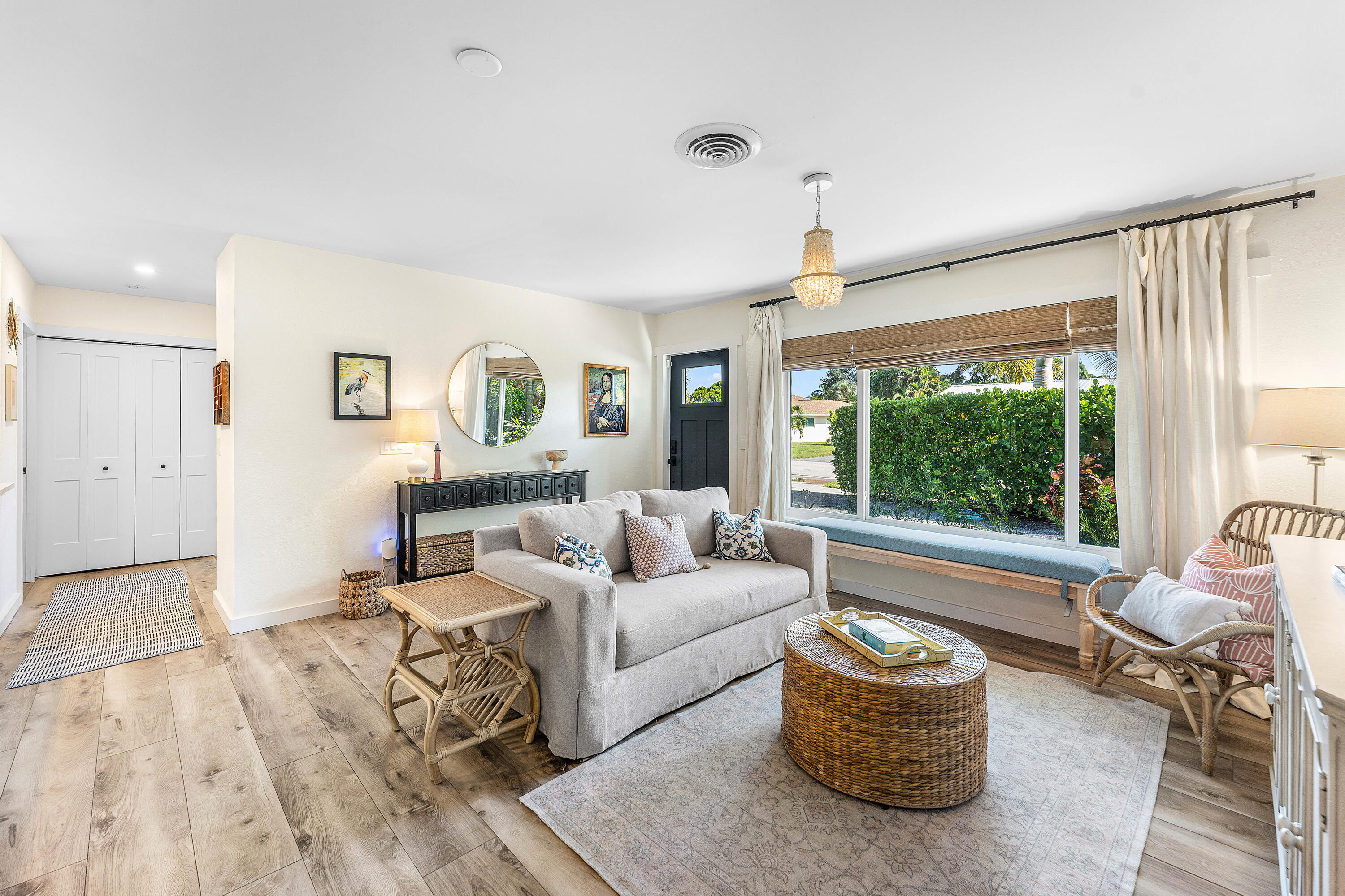514 Dover Road Tequesta, FL 33469 - Photo 10 of 37 a living room with furniture and a large window