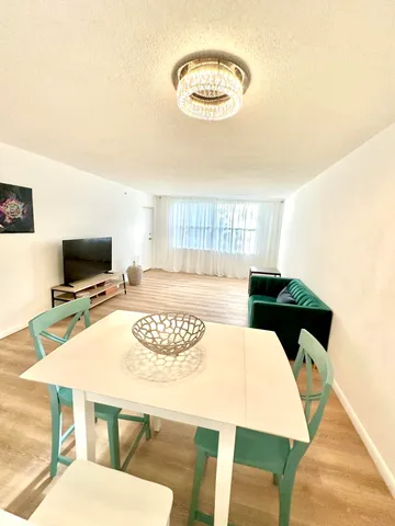 a living room with a couch and a flat screen tv