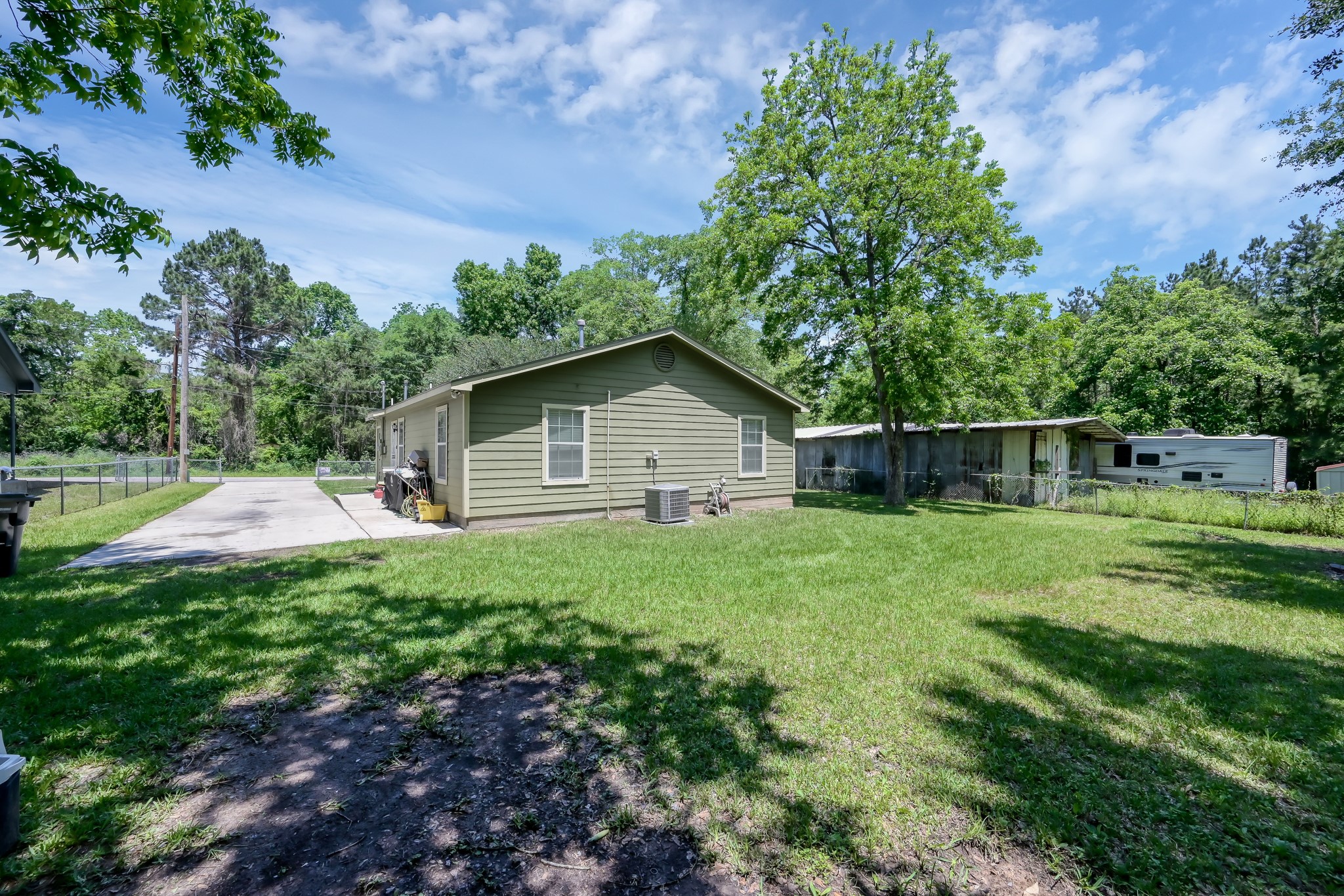 805 Webb Street Conroe, TX 77301 - Photo 18 of 19 a house view with a garden space