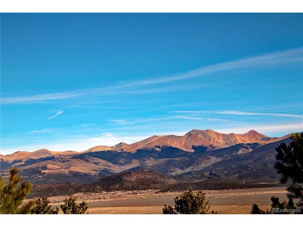 a view of ocean with mountains in the background