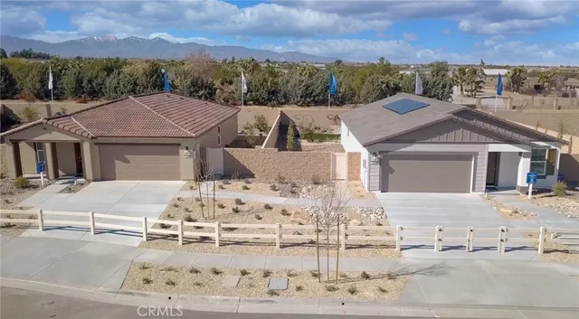 a view of a white house with a outdoor space