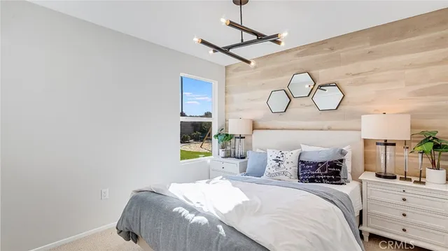 a bedroom with a bed and ceiling fan