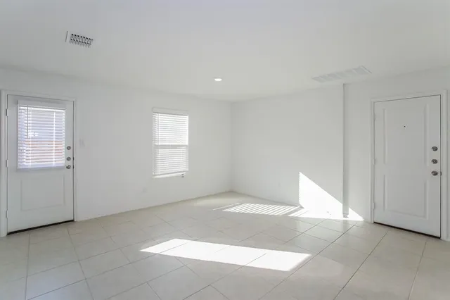 a view of an empty room with a window