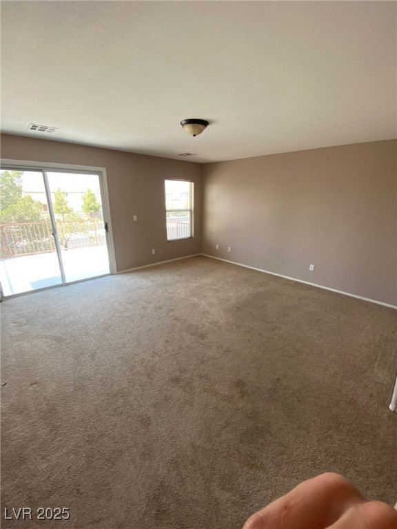 5817 Addy Lane, Unit N North Las Vegas, NV 89081 - Photo 9 of 32 Unfurnished room with carpet flooring and baseboards