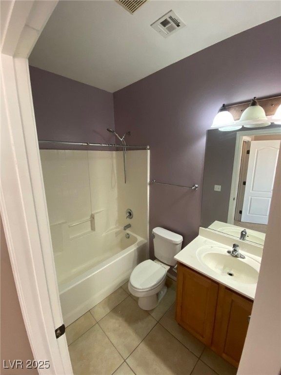 5817 Addy Lane, Unit N North Las Vegas, NV 89081 - Photo 11 of 32 Bathroom with shower / bath combination, vanity, and light tile patterned floors