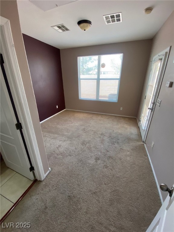 5817 Addy Lane, Unit N North Las Vegas, NV 89081 - Photo 12 of 32 Spare room with light carpet