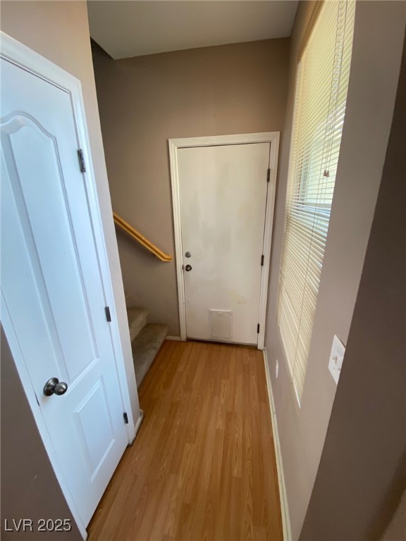 5817 Addy Lane, Unit N North Las Vegas, NV 89081 - Photo 13 of 32 Doorway to outside with stairway and wood finished floors