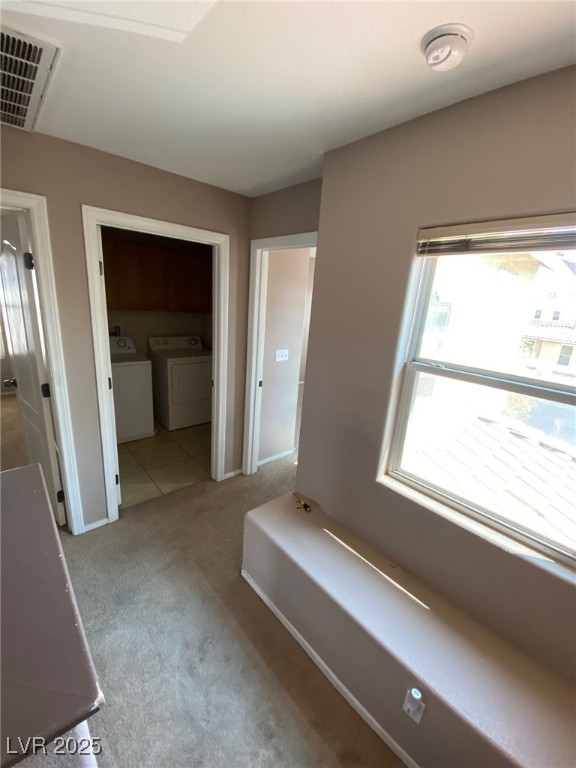 5817 Addy Lane, Unit N North Las Vegas, NV 89081 - Photo 15 of 32 Hall with light carpet and washer and dryer