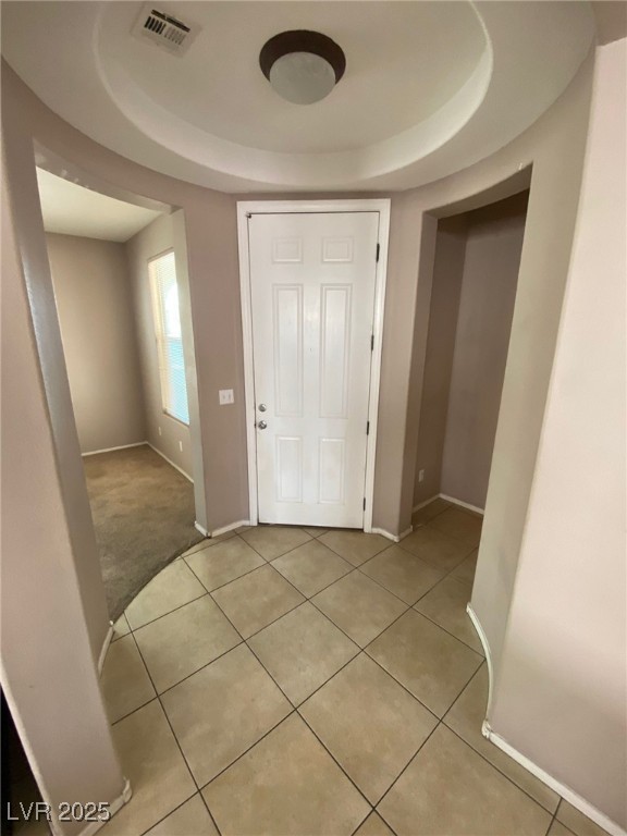 5817 Addy Lane, Unit N North Las Vegas, NV 89081 - Photo 2 of 32 Entryway with a tray ceiling and light tile patterned floors