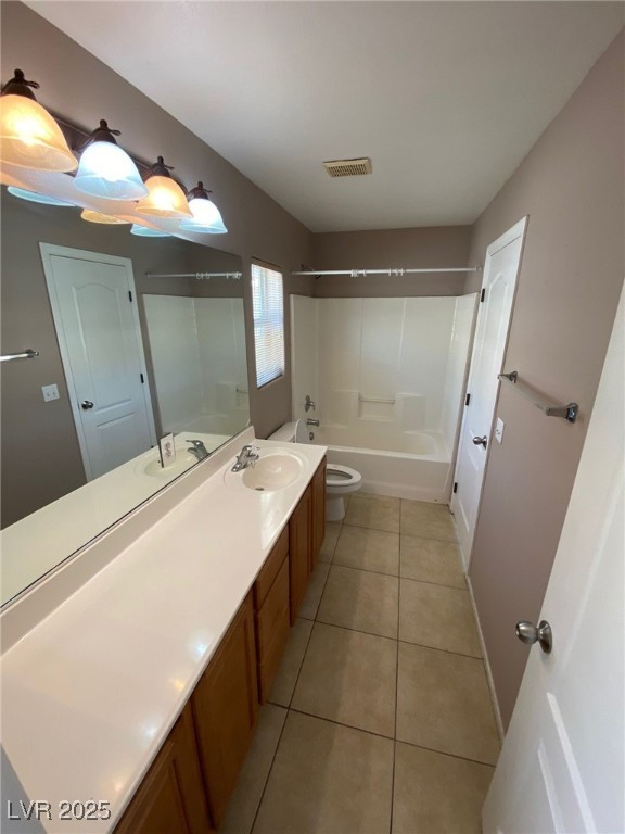 5817 Addy Lane, Unit N North Las Vegas, NV 89081 - Photo 20 of 32 Bathroom with bathing tub / shower combination, vanity, and light tile patterned floors