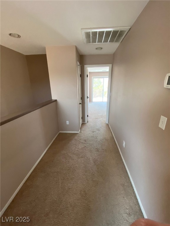 5817 Addy Lane, Unit N North Las Vegas, NV 89081 - Photo 22 of 32 Hall featuring light carpet and baseboards